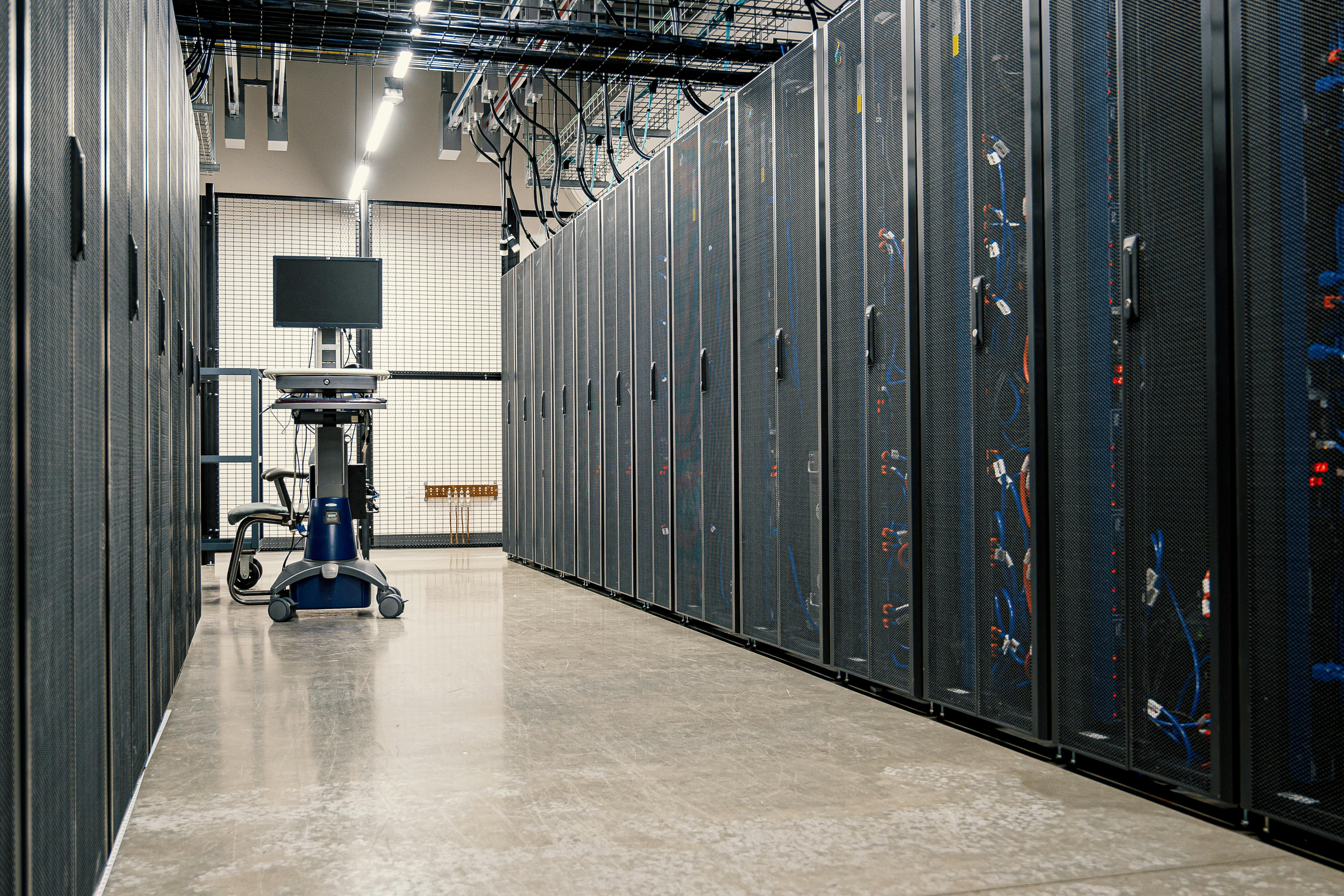 Photorealistic enterprise data center aisle with server racks and infrastructure equipment